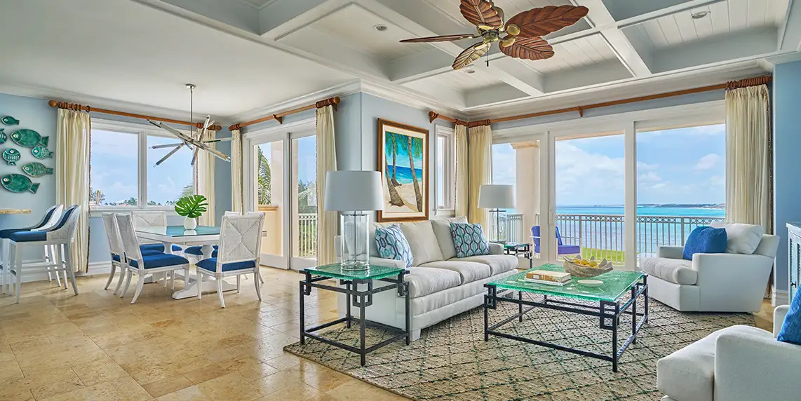 a living room with a couch and table and chairs